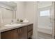 Clean bathroom with a single sink and bathtub at 1860 W 68Th Ave, Denver, CO 80221