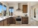 Modern kitchen with stainless steel appliances and wood cabinets at 1860 W 68Th Ave, Denver, CO 80221