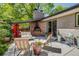 Relaxing back patio with a fireplace, comfortable seating, and stylish decor, perfect for outdoor living at 3010 Zinnia Ct, Golden, CO 80401