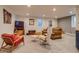 Cozy basement living area with comfortable seating, entertainment center and natural light at 3010 Zinnia Ct, Golden, CO 80401