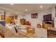 Open basement layout includes seating areas, wet bar, and entertainment options for a relaxed atmosphere at 3010 Zinnia Ct, Golden, CO 80401
