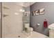 Modern bathroom with a glass shower enclosure, stylish vanity, and contemporary fixtures and decor at 3010 Zinnia Ct, Golden, CO 80401