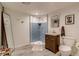 Bathroom featuring a tiled shower, modern vanity, and sleek fixtures at 3010 Zinnia Ct, Golden, CO 80401