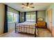 Comfortable bedroom with ample natural light from a large window and neutral-colored walls at 3010 Zinnia Ct, Golden, CO 80401