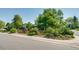 Well-maintained exterior showcasing lush landscaping, and inviting curb appeal of this property at 3010 Zinnia Ct, Golden, CO 80401