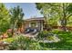 Charming home with a beautifully landscaped front yard and cozy patio seating at 3010 Zinnia Ct, Golden, CO 80401