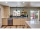 Updated kitchen with light wood cabinets, quartz countertops, and stainless steel appliances at 3010 Zinnia Ct, Golden, CO 80401