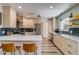 Bright kitchen with modern cabinetry, quartz countertops, and stainless steel appliances at 3010 Zinnia Ct, Golden, CO 80401