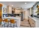 Modern kitchen features light wood cabinets, stainless steel appliances, and quartz countertops at 3010 Zinnia Ct, Golden, CO 80401
