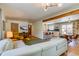 Bright, open-concept living space with hardwood floors, modern furnishings, and easy access to the kitchen at 3010 Zinnia Ct, Golden, CO 80401