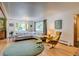 Inviting living room features hardwood floors, a large window, and a comfortable sectional sofa at 3010 Zinnia Ct, Golden, CO 80401