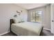 Cozy bedroom with a comfortable bed, ample natural light from the window, and neutral decor at 690 Howe Ct, Castle Rock, CO 80104
