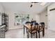 View of a bright dining room and large window overlooking trees outside at 690 Howe Ct, Castle Rock, CO 80104