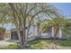 Lovely exterior view featuring a porch swing, mature trees, and well-maintained landscaping at 690 Howe Ct, Castle Rock, CO 80104