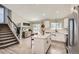 Contemporary kitchen with white cabinets, stainless steel appliances, and an island with seating at 690 Howe Ct, Castle Rock, CO 80104