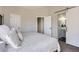View of the Main bedroom leading to a bathroom with sliding barn door entrance and two additional closet doors at 690 Howe Ct, Castle Rock, CO 80104