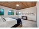 Bright bedroom with mountain views and wood ceilings at 699 Highlands Dr, Breckenridge, CO 80424