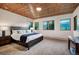 Spacious bedroom with mountain views and wood ceilings at 699 Highlands Dr, Breckenridge, CO 80424