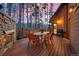 Deck with mountain views, dining furniture, and fire pit at 699 Highlands Dr, Breckenridge, CO 80424