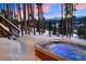 Hot tub with snowy mountain views at sunset at 699 Highlands Dr, Breckenridge, CO 80424