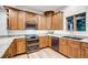 Well-equipped kitchen with wood cabinets and granite countertops at 699 Highlands Dr, Breckenridge, CO 80424