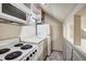 Small galley kitchen with microwave and stove at 699 Highlands Dr, Breckenridge, CO 80424