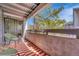 Relaxing balcony featuring stylish chairs, a vibrant rug, and sliding glass door access at 6420 S Dayton St # J07, Englewood, CO 80111