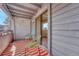 Inviting balcony showcasing comfortable seating, an eye-catching rug, and natural light at 6420 S Dayton St # J07, Englewood, CO 80111