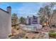 Scenic view of community pool, mature trees, and attractive landscaping around buildings at 6420 S Dayton St # J07, Englewood, CO 80111