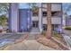 Exterior view of the condo complex with well-maintained landscaping and visible unit entrances at 6420 S Dayton St # J07, Englewood, CO 80111