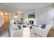 Inviting living room with a decorative fireplace, modern furniture, and a mounted TV at 6420 S Dayton St # J07, Englewood, CO 80111