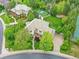 Expansive property with lush landscaping, basketball court, sand pit, and a grand home featuring a tile roof at 291 Fairchild Dr, Highlands Ranch, CO 80126