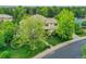 Aerial view of a beautiful home with lush landscaping and a well-maintained lawn at 291 Fairchild Dr, Highlands Ranch, CO 80126
