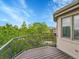 A spacious balcony overlooks lush greenery, offering a private outdoor retreat at 291 Fairchild Dr, Highlands Ranch, CO 80126
