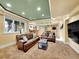 Finished basement with a lounge, a wet bar, recreation area, and neutral carpet, perfect for entertaining at 291 Fairchild Dr, Highlands Ranch, CO 80126