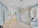 Bright bathroom featuring a glass-enclosed shower, double vanities, and ample storage at 291 Fairchild Dr, Highlands Ranch, CO 80126
