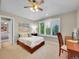 Cozy bedroom features a sunny window with shutters and a comfortable study area at 291 Fairchild Dr, Highlands Ranch, CO 80126