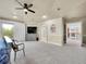 This primary bedroom features a ceiling fan, balcony access, and attached sitting area at 291 Fairchild Dr, Highlands Ranch, CO 80126