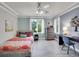 This bedroom includes a desk area and large windows providing natural light at 291 Fairchild Dr, Highlands Ranch, CO 80126