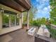 Relax on the spacious deck with an outdoor fire pit and comfortable seating, perfect for entertaining at 291 Fairchild Dr, Highlands Ranch, CO 80126
