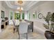 Elegant dining room with large windows and chandelier at 291 Fairchild Dr, Highlands Ranch, CO 80126