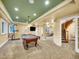 Basement game room with pool table, home gym, and entertainment area at 291 Fairchild Dr, Highlands Ranch, CO 80126