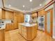 Gourmet kitchen with granite counters, stainless steel appliances, and hardwood floors at 291 Fairchild Dr, Highlands Ranch, CO 80126