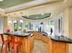 This kitchen features a spacious granite countertop and lots of natural light at 291 Fairchild Dr, Highlands Ranch, CO 80126