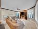 Comfortable living room featuring a fireplace, built-in shelving, bay window, and plush seating at 291 Fairchild Dr, Highlands Ranch, CO 80126