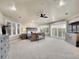 Spacious main bedroom with ample natural light, neutral tones, and balcony access through sliding glass doors at 291 Fairchild Dr, Highlands Ranch, CO 80126