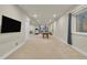 Finished basement features a large TV and plenty of recreational space at 3762 White Rose Loop, Castle Rock, CO 80108