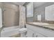 Well-lit bathroom features a shower-tub combination and a granite-topped vanity at 3762 White Rose Loop, Castle Rock, CO 80108