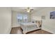 Bright bedroom with plantation shutters and hardwood floors at 3762 White Rose Loop, Castle Rock, CO 80108