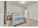 Neutral bedroom with a side table, bedside lamp and carpet at 3762 White Rose Loop, Castle Rock, CO 80108